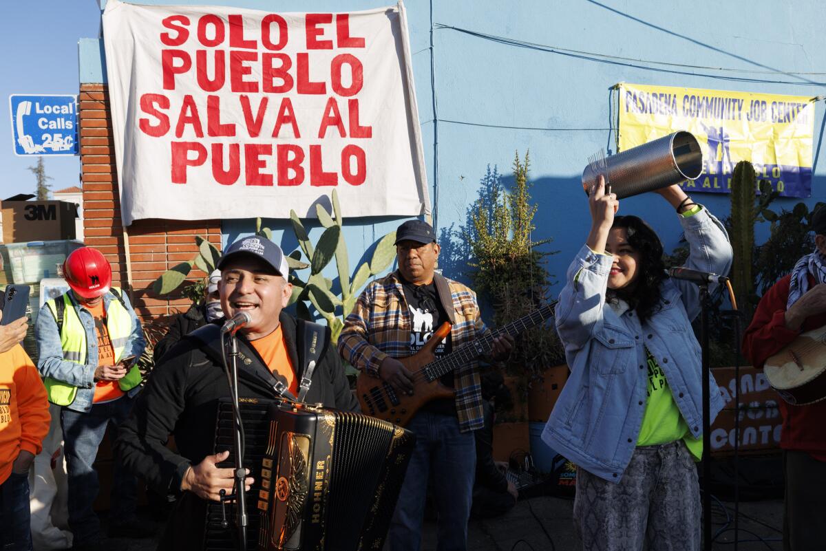 Pablo Alvarado, co-executive director of the National Day Laborer Organizing Network, plays the bass