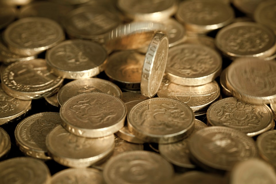 Pile of British one-pound coins.