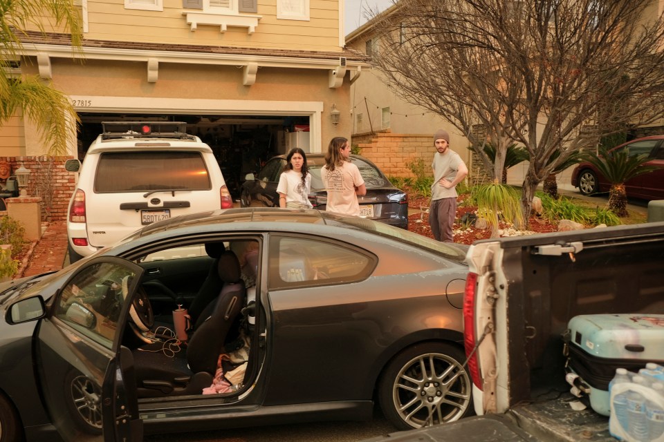 People evacuating their homes during a fire.