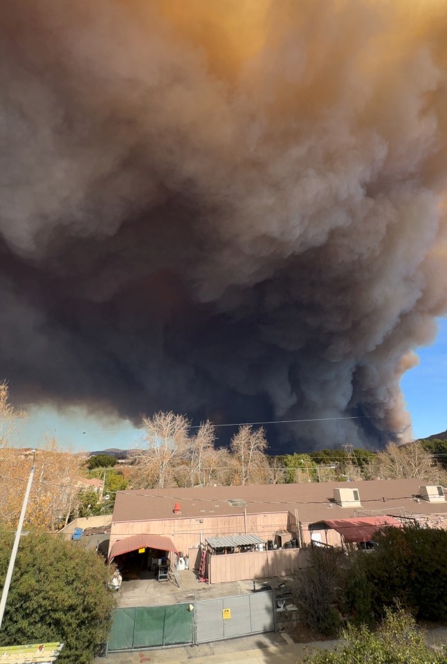 Smoke from the Hughes Fire over a residential area in Castaic, California.