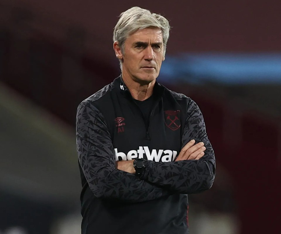 Alan Irvine, assistant manager for West Ham United, stands with arms crossed.