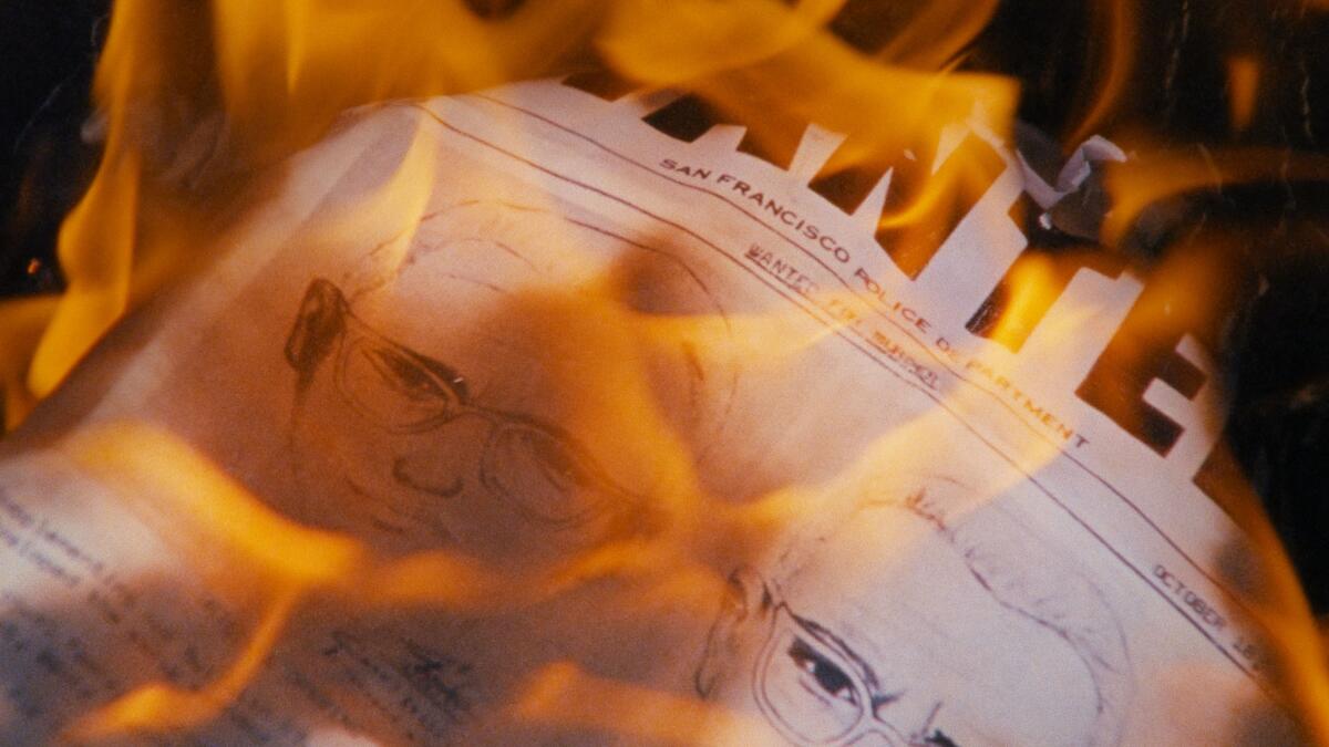 A police sketch burns into flames.