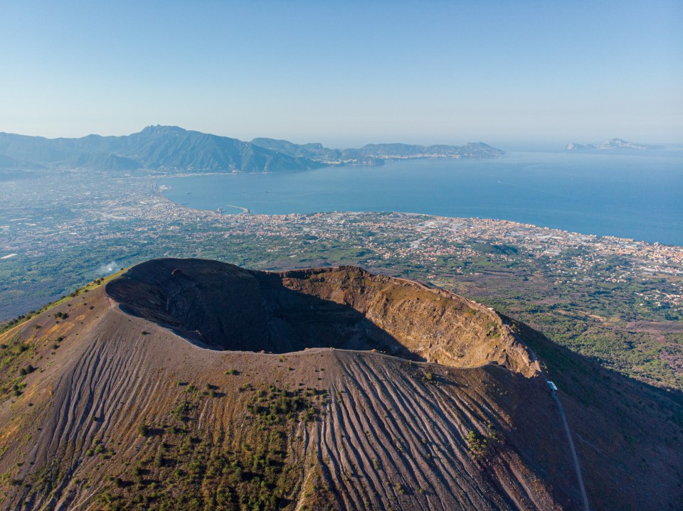 Aerial view of Mount Vesuvius crater and the Bay of Naples.