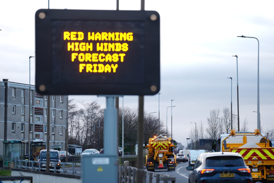 Road sign: Red warning, high winds forecast Friday.