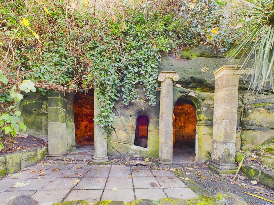 Temple-style cave in a garden.