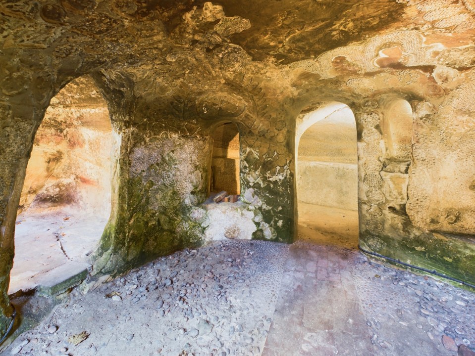 Interior of a temple-style cave in a garden.