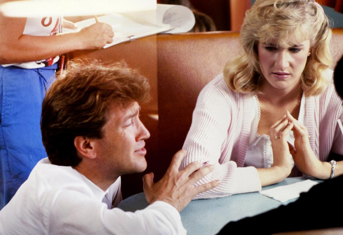 David Lynch directs Laura Dern in a scene for his 1986 movie, "Blue Velvet."