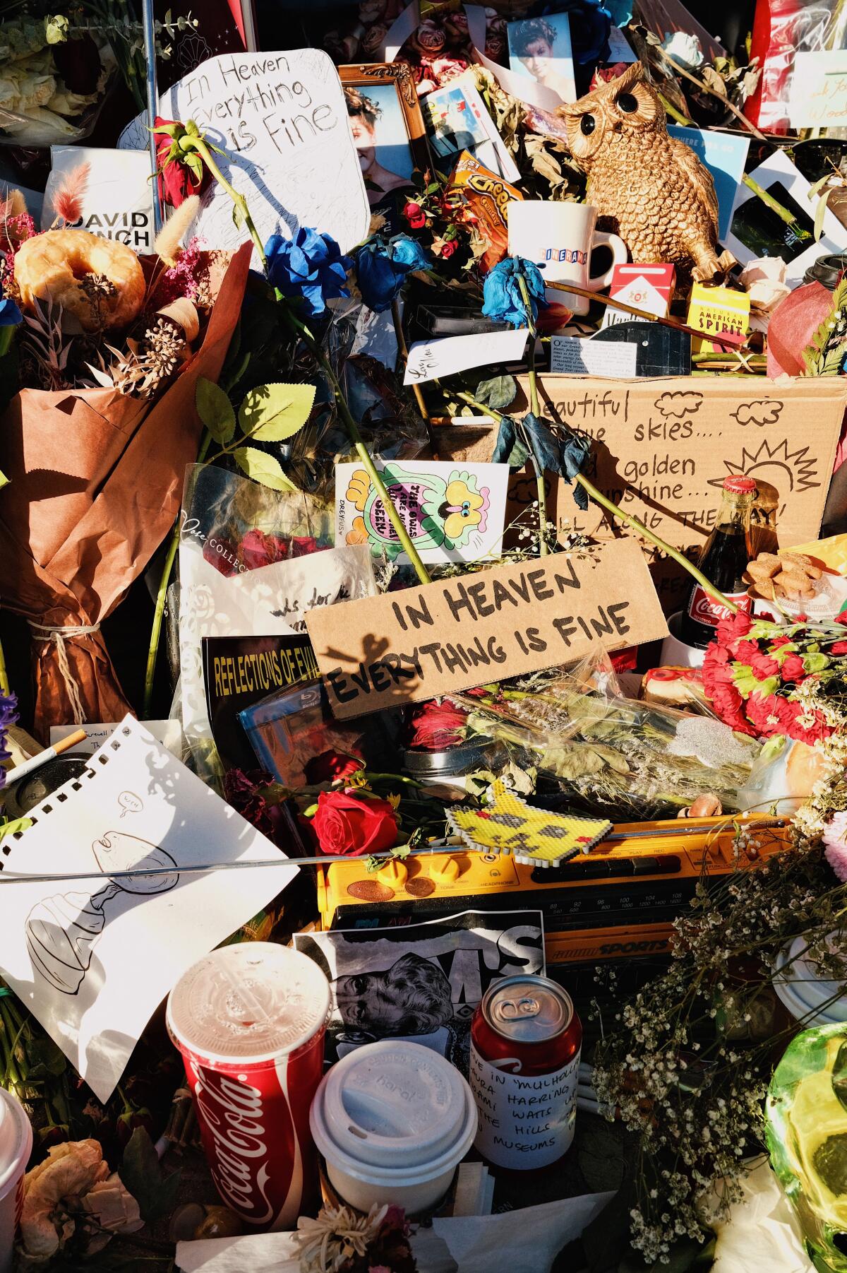 Flowers, signs and other gifts at the impromptu memorial for David Lynch at Bob's Big Boy Burbank