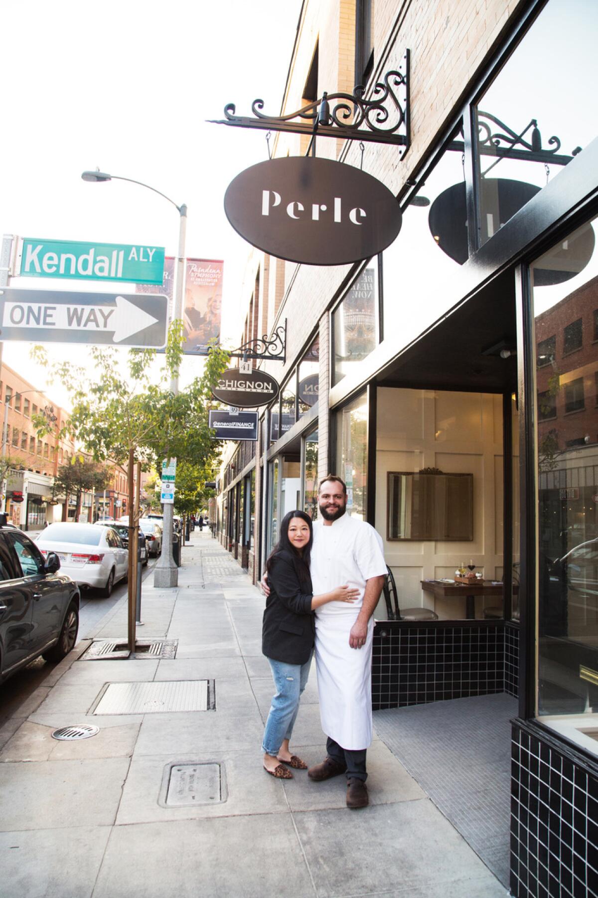 Pauline and Dean Yasharian stand in front of Perle, their French restaurant in Old Town Pasadena.