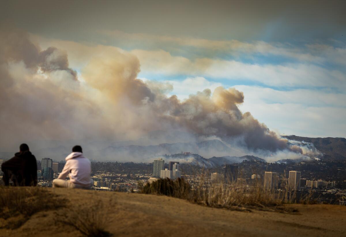 A huge cream and gray plume of wildfire smoke covers a huge swath of Los Angeles County.