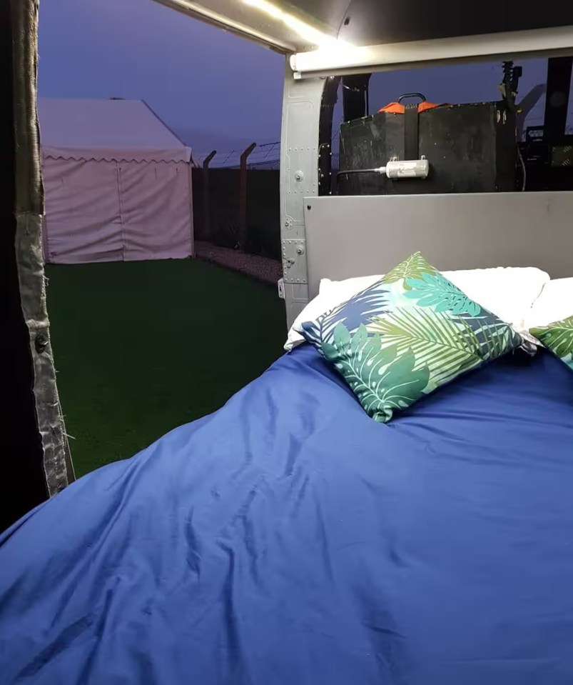 Double bed in a converted helicopter.