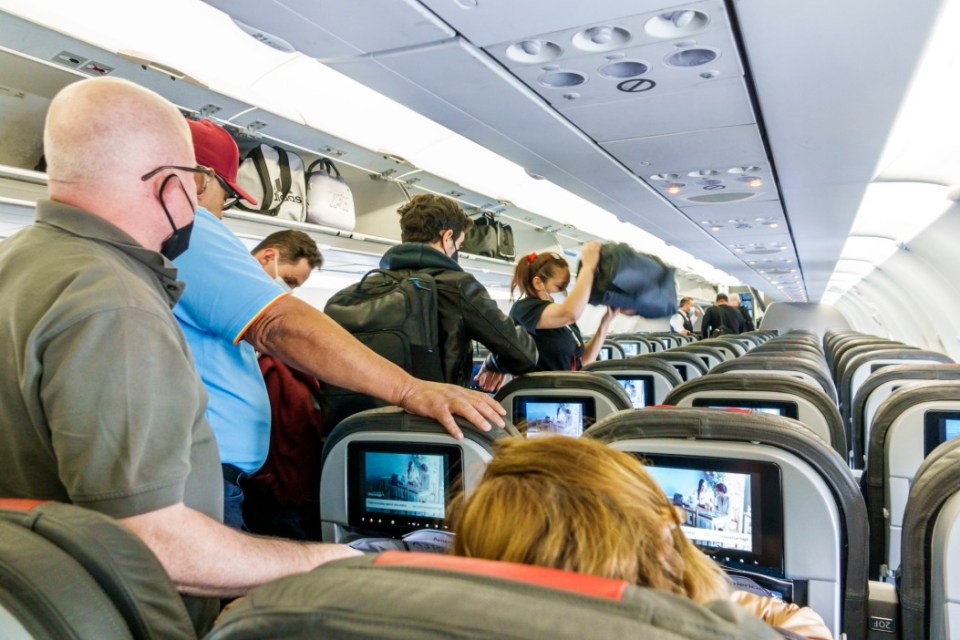 Passengers disembarking from an airplane.