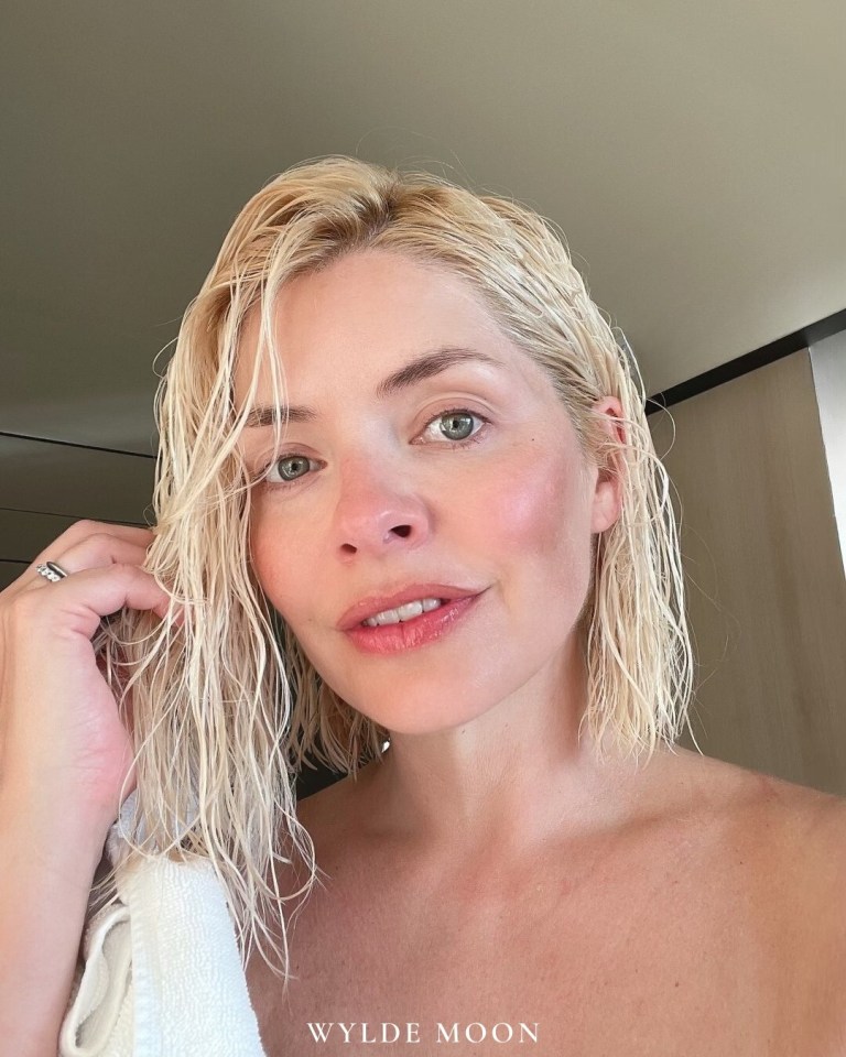 Holly Willoughby drying her hair.