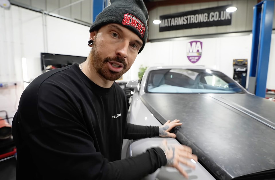 Screengrab of YouTuber Mat Armstrong inspecting a damaged Rolls Royce Wraith.