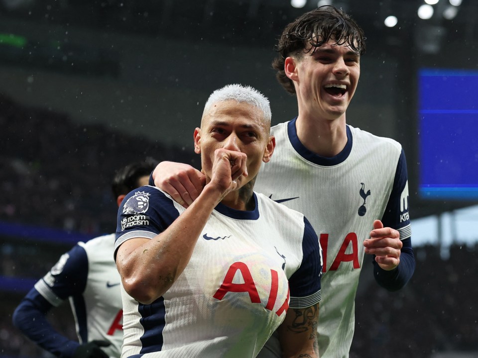 Richarlison of Tottenham Hotspur celebrates a goal with a teammate.