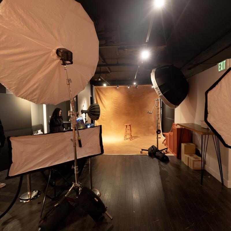 empty photo studio with people setting up