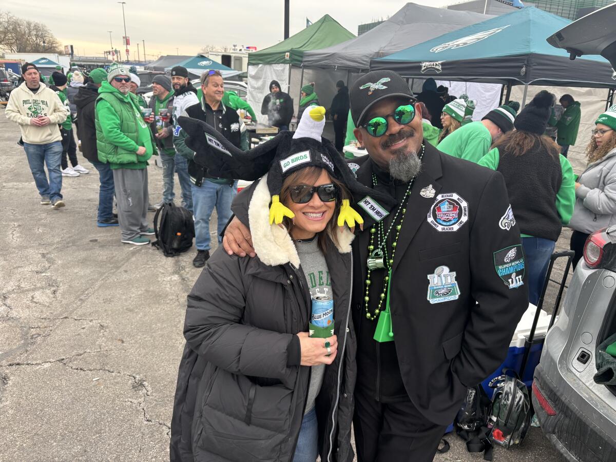 Fans Jay Vignetti and Tal Sims are in full Eagles gear at their tailgate.