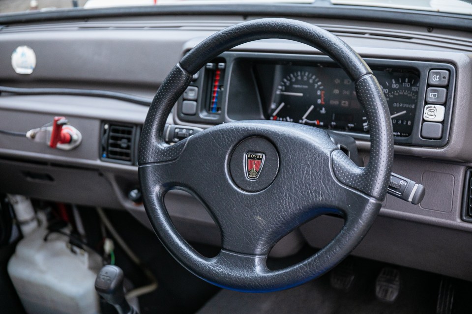 Close-up of the steering wheel and dashboard of a record-breaking 1989 MG Metro GTI.