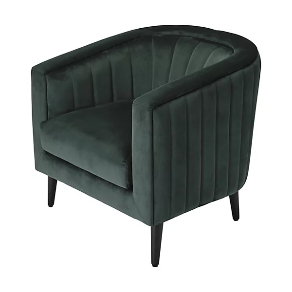 Dark green velvet armchair with channel tufting.