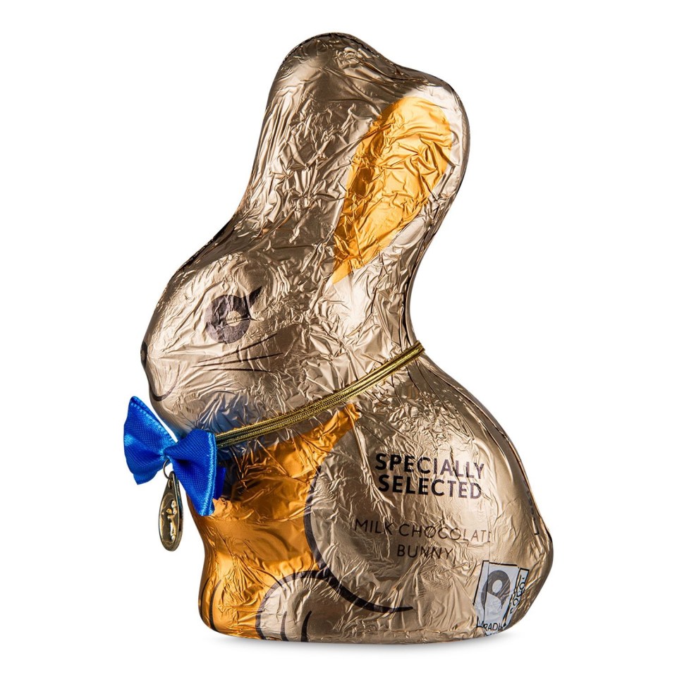 Milk chocolate bunny in gold foil wrapper with blue bow.