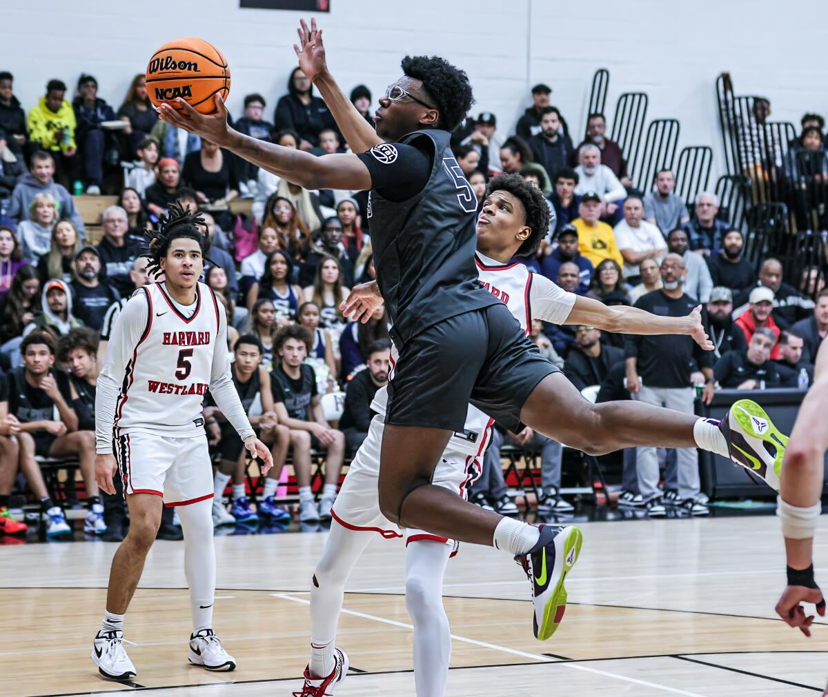 Bryce James of Sierra Canyon drives against Harvard-Westlake.