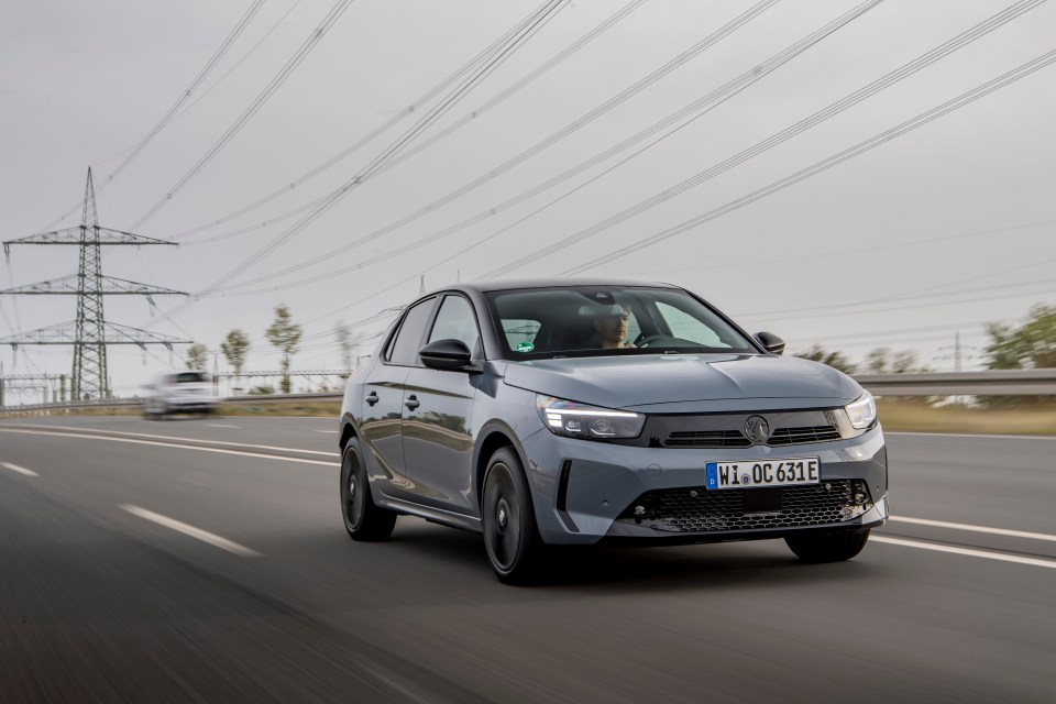 Gray car driving on a highway.