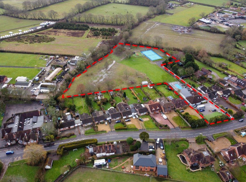 Aerial view of a property with a tennis court and home gym, subject of an enforcement notice.