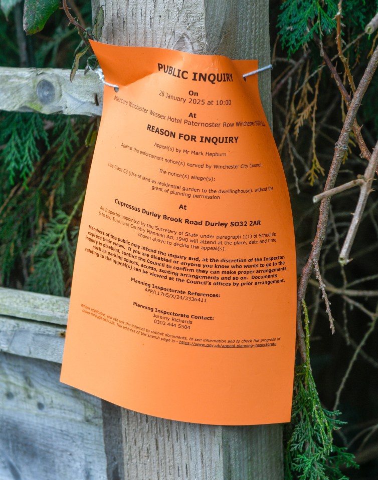 Public inquiry notice posted outside a property.