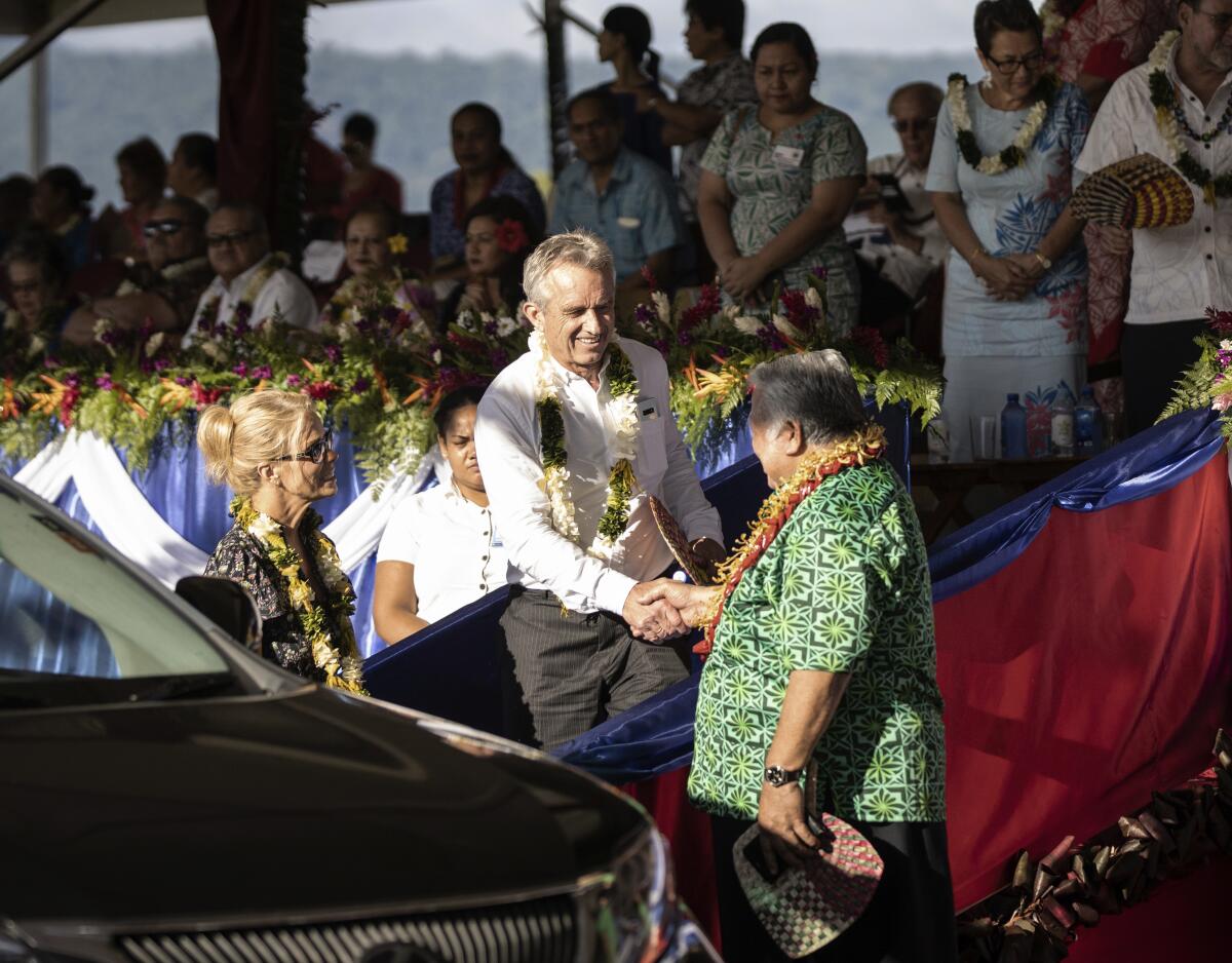 Samoan Prime Minister Tuilaepa Sailele Malielegaoi shakes hands with Robert F. Kennedy Jr. during his 2019 visit.