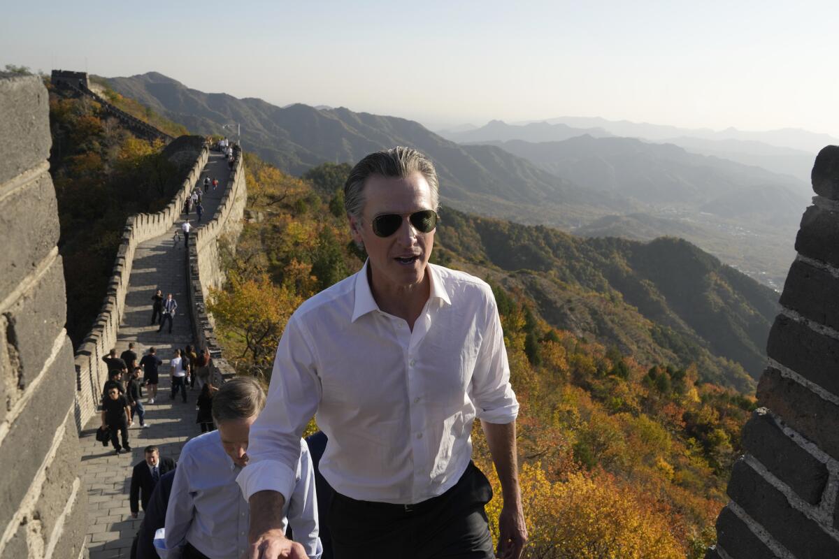 Gov. Gavin Newsom walks up a section of the Great Wall of China in 2023.