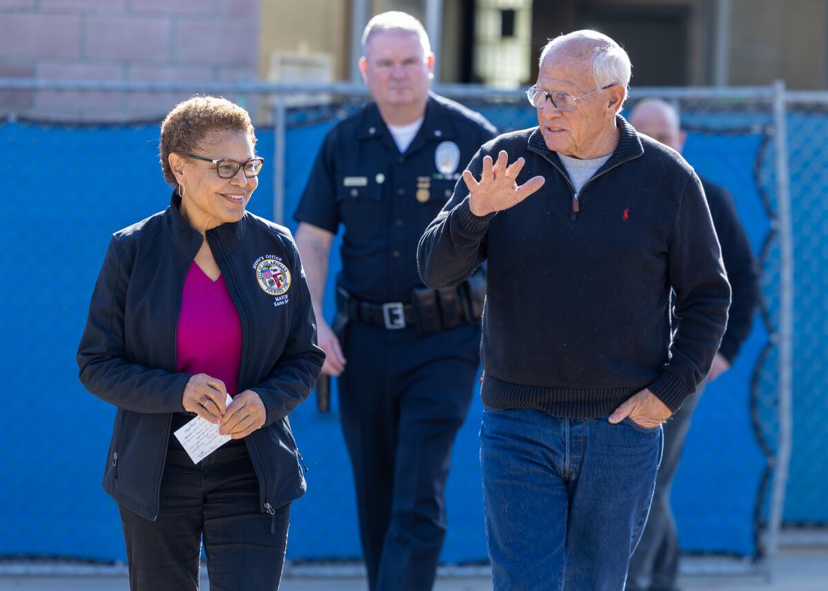 Los Angeles Mayor Karen Bass, left, and her chief recovery officer, Steve Soboroff, arrive at a news conference on Monday.