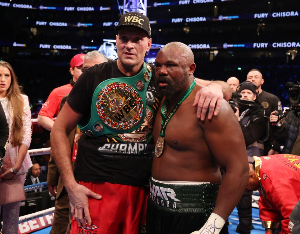 Tyson Fury and Derek Chisora after a boxing match, Fury is the WBC Heavyweight Champion.