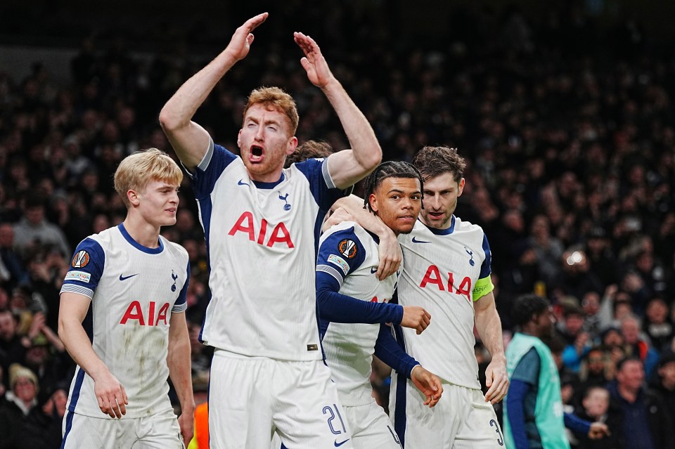 Tottenham Hotspur players celebrating a goal.