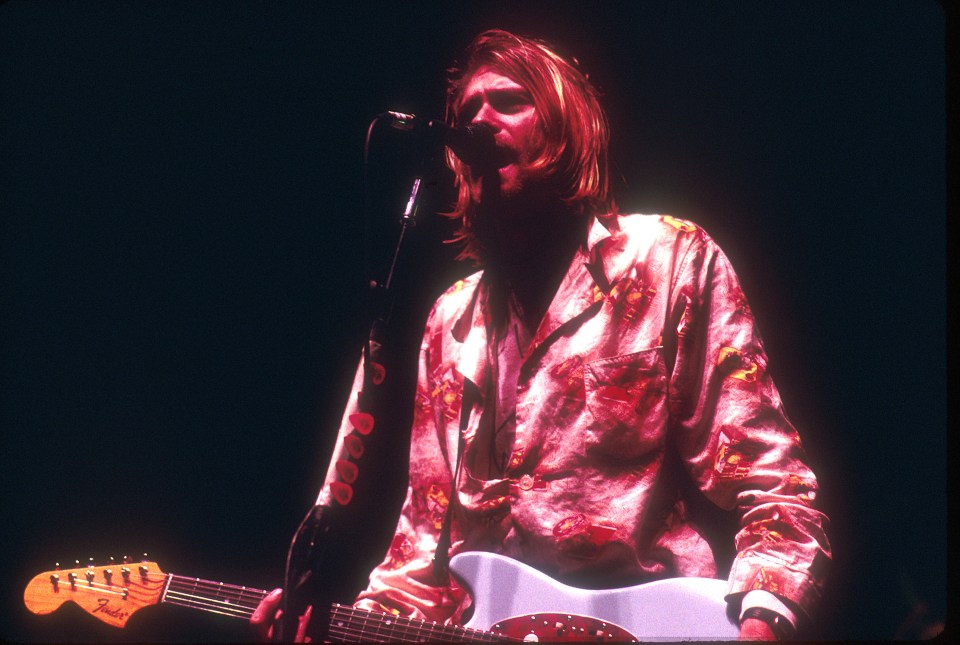 Kurt Cobain of Nirvana performing on stage.