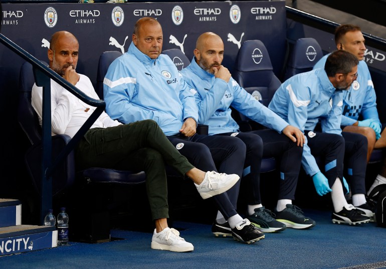 Soccer Football - Premier League - Manchester City v Nottingham Forest - Etihad Stadium, Manchester, Britain - August 31, 2022 Manchester City manager Pep Guardiola sat alongside assistant coaches Rodolfo Borrell and Enzo Maresca before the match Action Images via Reuters/Jason Cairnduff EDITORIAL USE ONLY. No use with unauthorized audio, video, data, fixture lists, club/league logos or 'live' services. Online in-match use limited to 75 images, no video emulation. No use in betting, games or single club /league/player publications. Please contact your account representative for further details.