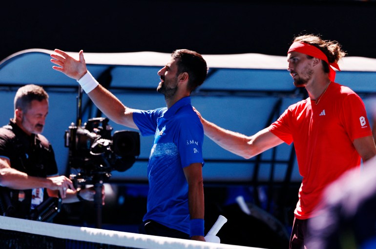 Tennis - Australian Open - Melbourne Park, Melbourne, Australia - January 24, 2025 Serbia's Novak Djokovic shakes hands with the umpire after retiring from his semi final match against Germany's Alexander Zverev REUTERS/Tingshu Wang