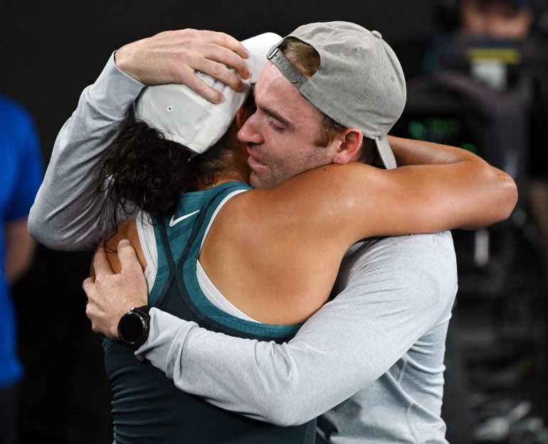 Tennis - Australian Open - Melbourne Park, Melbourne, Australia - January 25, 2025 Madison Keys of the U.S. celebrates with her coach and husband Bjorn Fratangelo after winning the final against Belarus' Aryna Sabalenka REUTERS/Jaimi Joy