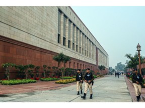 Security personnel outside the Parliament House in New Delhi. Photographer: Prakash Singh/Bloomberg