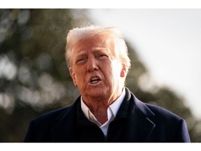 US President Donald Trump speaks to members of the media on the South Lawn of the White House before boarding Marine One in Washington, DC, US, on Friday, Jan. 24, 2025. Trump will head to Los Angeles to survey wildfire damage after visiting North Carolina, which was recently hit by hurricanes.