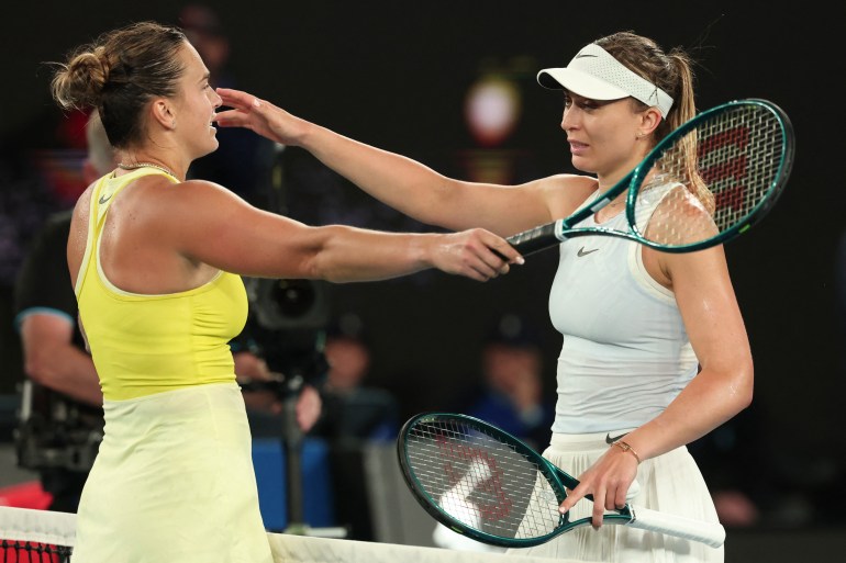 Winner Aryna Sabalenka of Belarus (L) and Spain's Paula Badosa embrace at the net after their women's singles semi-final match on day twelve of the Australian Open tennis tournament in Melbourne on January 23, 2025. (Photo by DAVID GRAY / AFP) / -- IMAGE RESTRICTED TO EDITORIAL USE - STRICTLY NO COMMERCIAL USE --