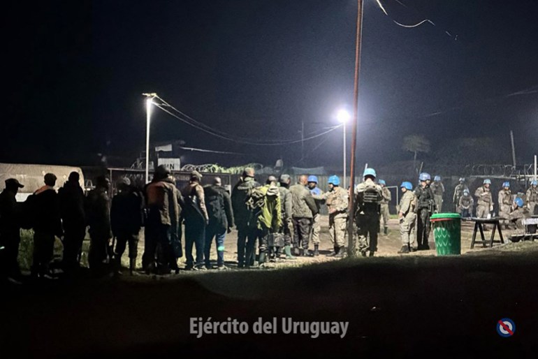 This handout picture released on January 26, 2025, by the Uruguayan Army shows soldiers of the Armed Forces of the Democratic Republic of the Congo (FARDC) reportedly handing over their weapons to Uruguayan soldiers of the United Nations Organization Stabilization Mission in the Democratic Republic of the Congo (MONUSCO) in Goma, Republic Democratic of Congo. (Photo by Handout / Uruguayan Army / AFP) / RESTRICTED TO EDITORIAL USE - MANDATORY CREDIT "AFP PHOTO / URUGUAYAN ARMY / HANDOUT / " - NO MARKETING NO ADVERTISING CAMPAIGNS - DISTRIBUTED AS A SERVICE TO CLIENTS