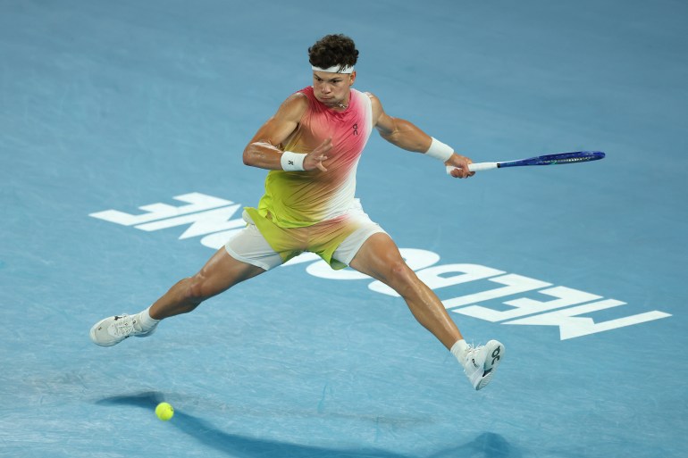 Ben Shelton of the United States plays a forehand return a forehand during the semifinal with Sinner [Clive Brunskill/Getty Images]