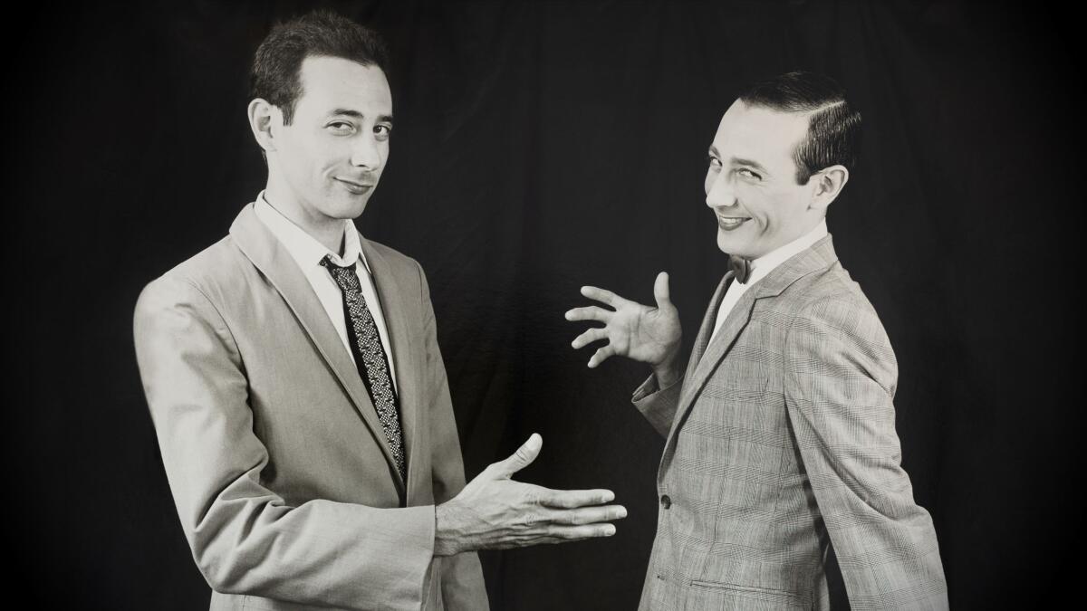 Paul Reubens in character as Pee-wee Herman, twice over.