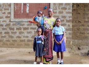 Caroline from Kilifi Count walks her granddaughters to school, continuing her family's dedication to education, supported by Plan Canada. (Photo Credit: Armstrong Too)