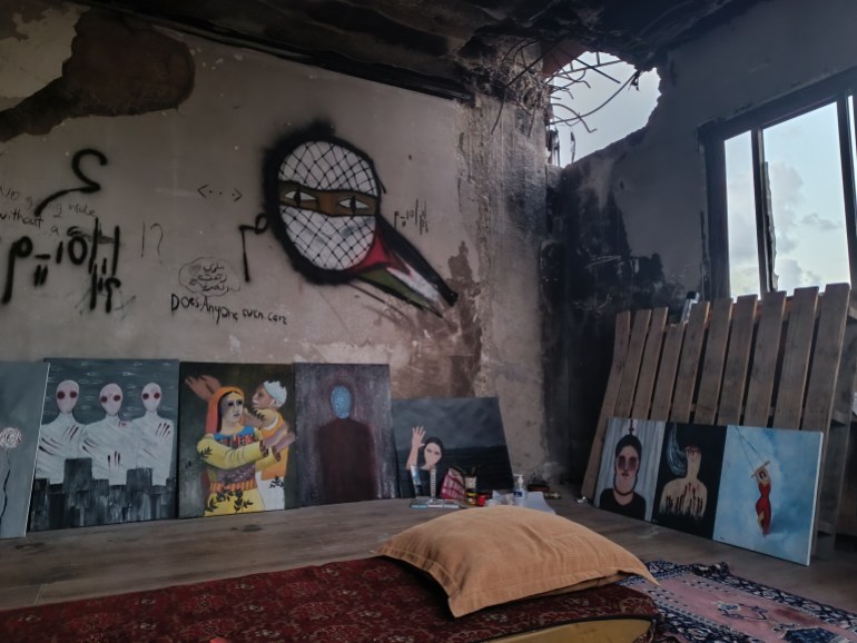 Ibrahim Mohana’s makeshift studio stands amid the ruins of his home, partially destroyed by an Israeli tank shell. 