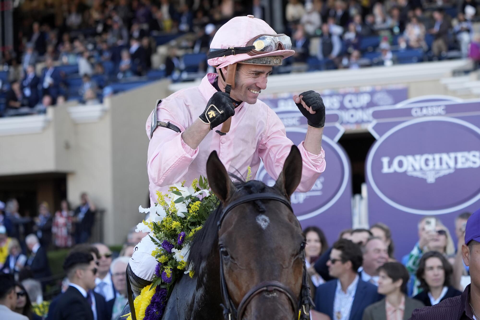 Flavien Prat celebrates after riding Sierra Leone to victory in the Breeders' Cup Classic horse race