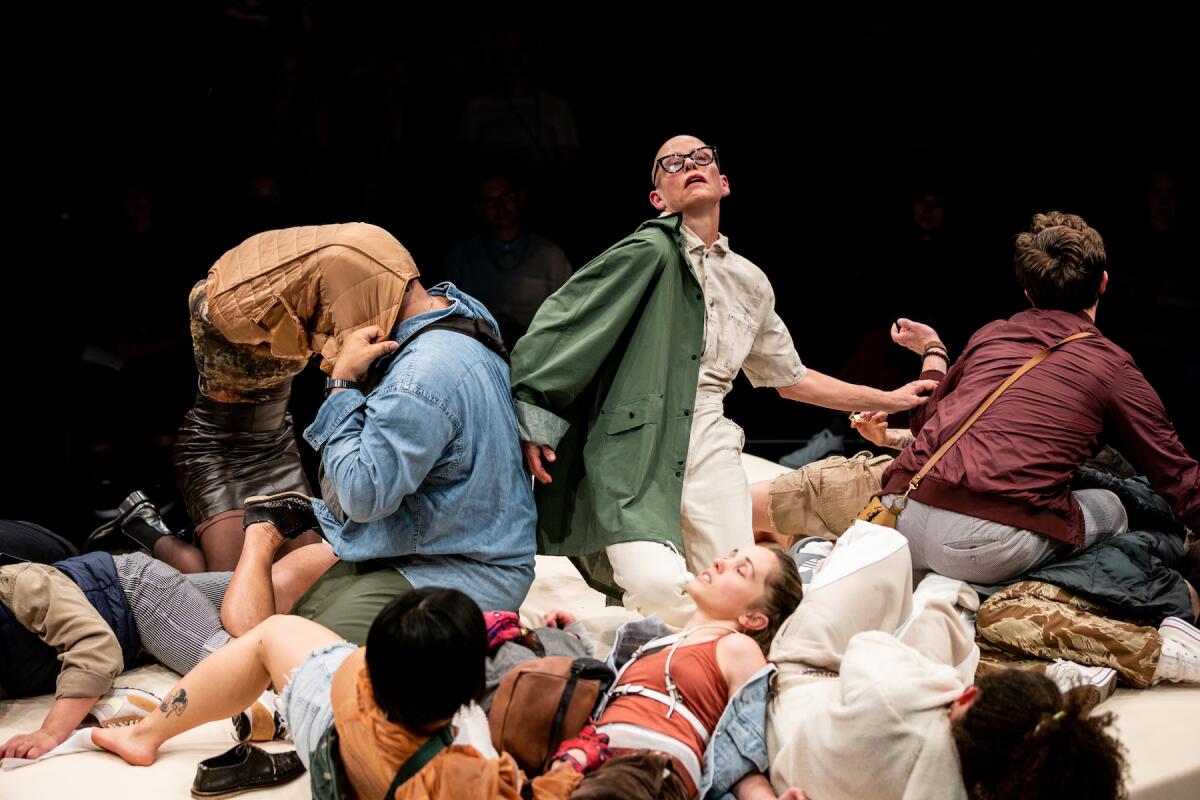 A group of young men and women lying and sitting on the floor