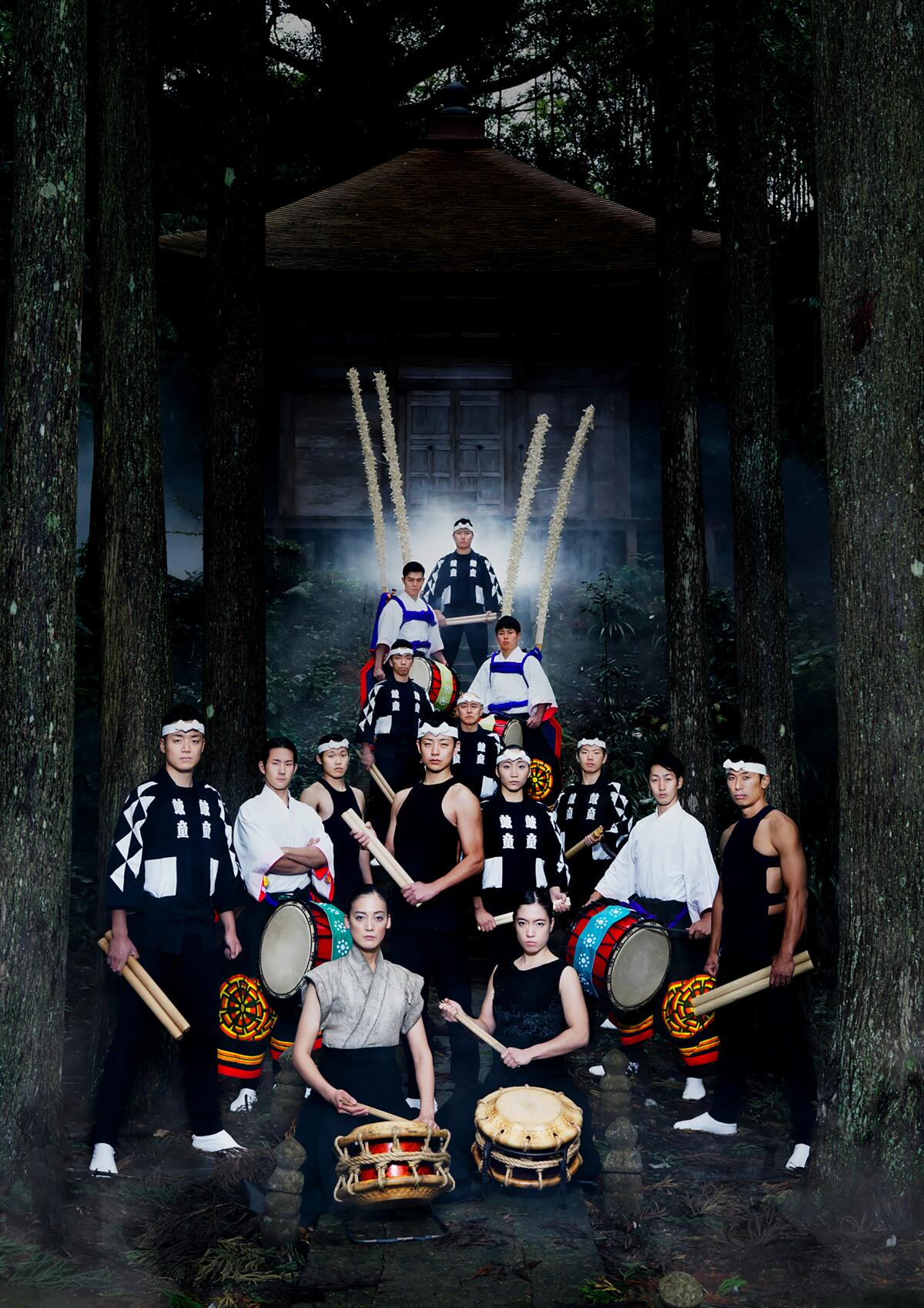 Members of the Japanese group KODO with large taiko drums