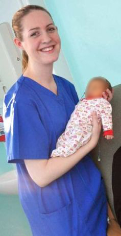 Nurse holding a baby.