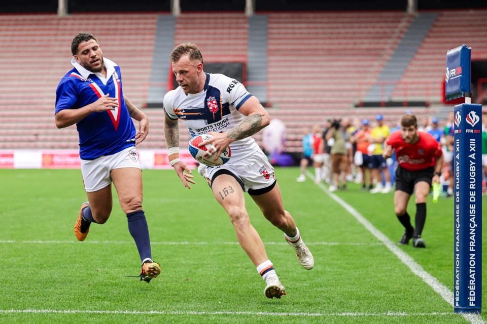 Rugby player running with the ball during a France vs England match.